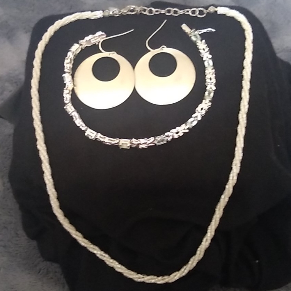 Light blue necklace, bracelet, and hoop earrings